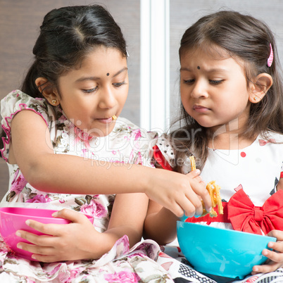 Sibling sharing foods