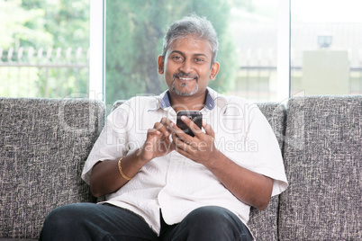 Indian man using smart phone