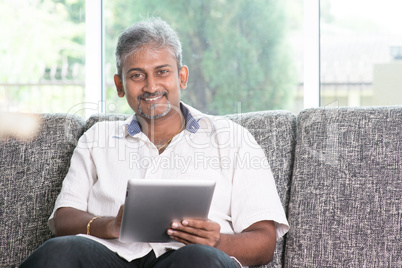 Indian using touch screen tablet pc