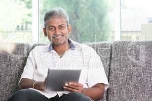 Indian using touch screen tablet pc