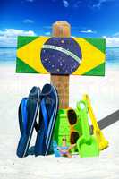 Holzschild mit Brasilien Flagge am Strand