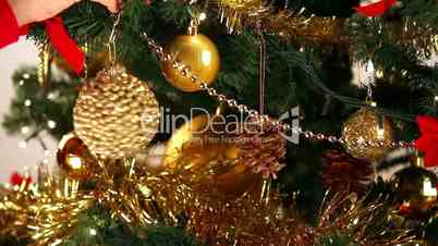 Decorating Christmas tree close-up
