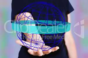 Hand holding grid sphere with orbiting arrow