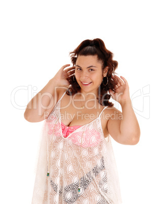 Young woman in bikini with lace shirt.