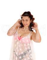 Young woman in bikini with lace shirt.