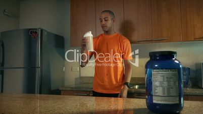 4 Man Athlete Drinks Protein Milk Shake After Training