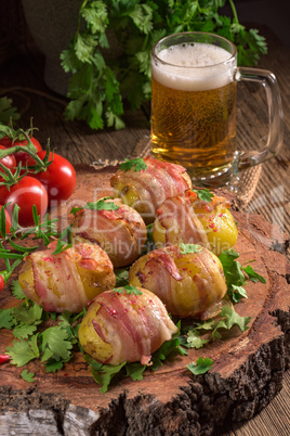 Baked potatoes wrapped in ham