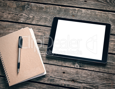 Tablet with ring binder on desktop