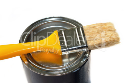 Brush and closed paint pot