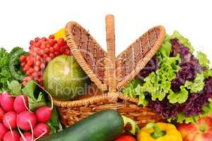 vegetables and fruits in a basket isolated on white background