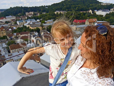 Daughter and mother on the downtown background