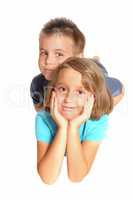 A sister and brother lying on the floor.