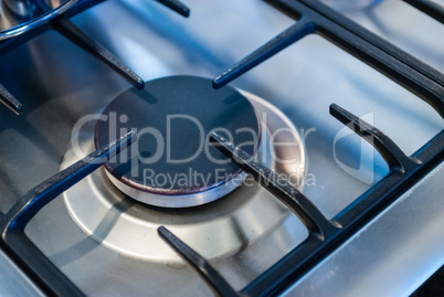 Metallic kitchen stove burner and frame