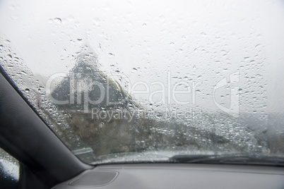 A car window in heavy rain