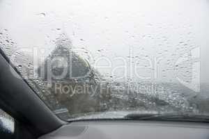 A car window in heavy rain