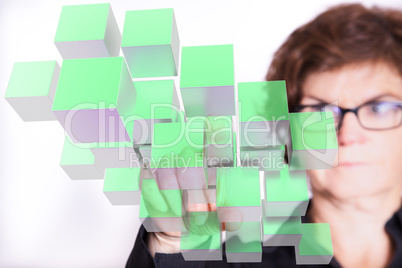 Woman typing on virtual cube