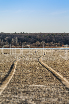 The road along the bottom of the dried lake