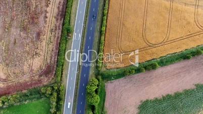 Aerial View Of A Traffic Driving On A Motorway