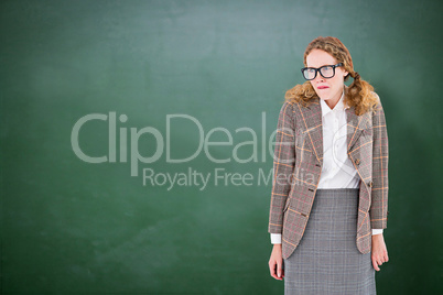 Composite image of geeky hipster woman looking nervous