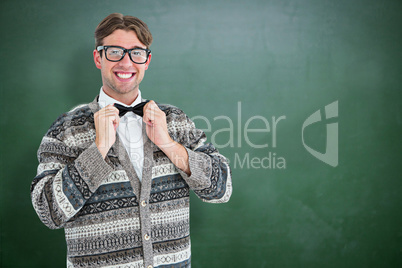 Composite image of happy geeky hipster with wool jacket