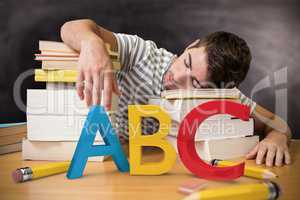 Composite image of student asleep in the library