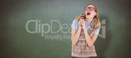 Composite image of geeky hipster woman singing into a microphone