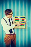 Composite image of geeky businessman using an abacus