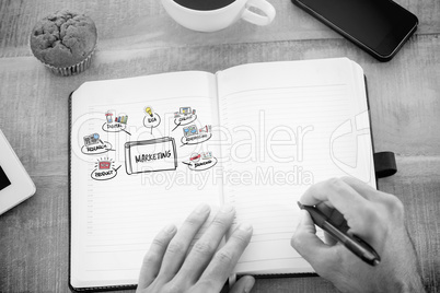 Composite image of man writing notes on diary