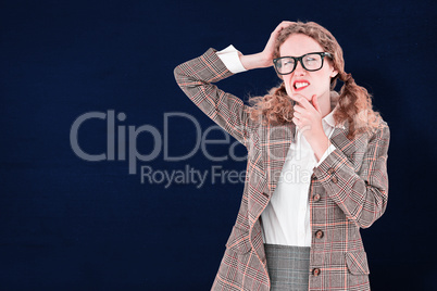 Composite image of geeky hipster thinking with hands on chin and