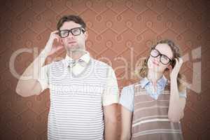 Composite image of geeky hipster couple thinking with hand on te