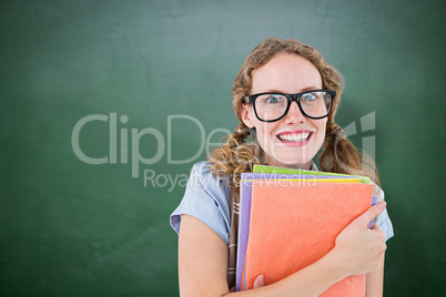 Composite image of geeky hipster woman holding files