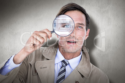 Composite image of spy looking through magnifier