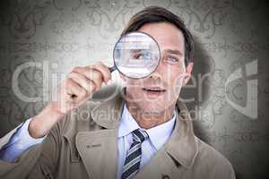 Composite image of spy looking through magnifier