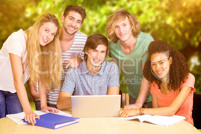 Composite image of college students using laptop in library