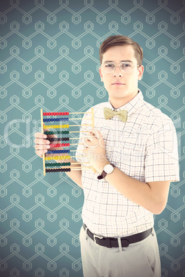 Composite image of geeky hipster holding an abacus