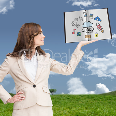 Composite image of pretty businesswoman showing a book