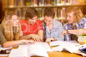 Composite image of college students doing homework in library