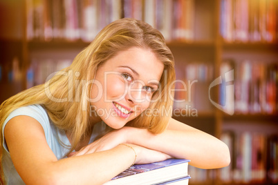 Composite image of portrait of female student in library