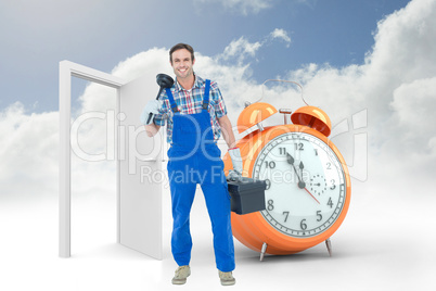 Composite image of portrait of plumber holding plunger and tool