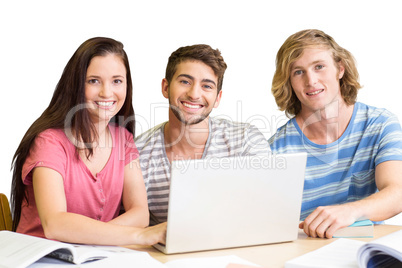 Composite image of college students using laptop in library