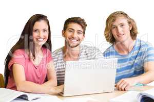 Composite image of college students using laptop in library