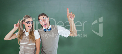 Composite image of geeky hipsters pointing