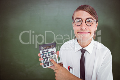 Composite image of geeky smiling businessman showing calculator