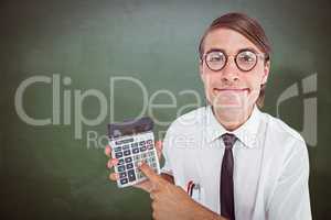 Composite image of geeky smiling businessman showing calculator