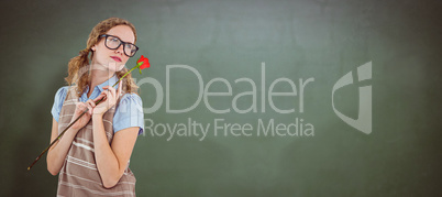 Composite image of geeky hipster woman holding rose