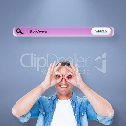 Composite image of smiling man with fingers around his eyes