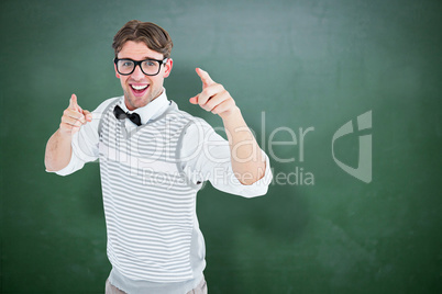 Composite image of geeky hipster in sweater vest dancing