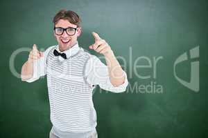 Composite image of geeky hipster in sweater vest dancing