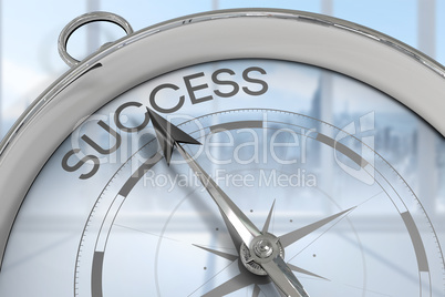 Composite image of compass pointing to success