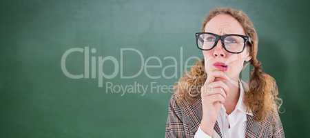 Composite image of geeky hipster woman thinking with hand on chi